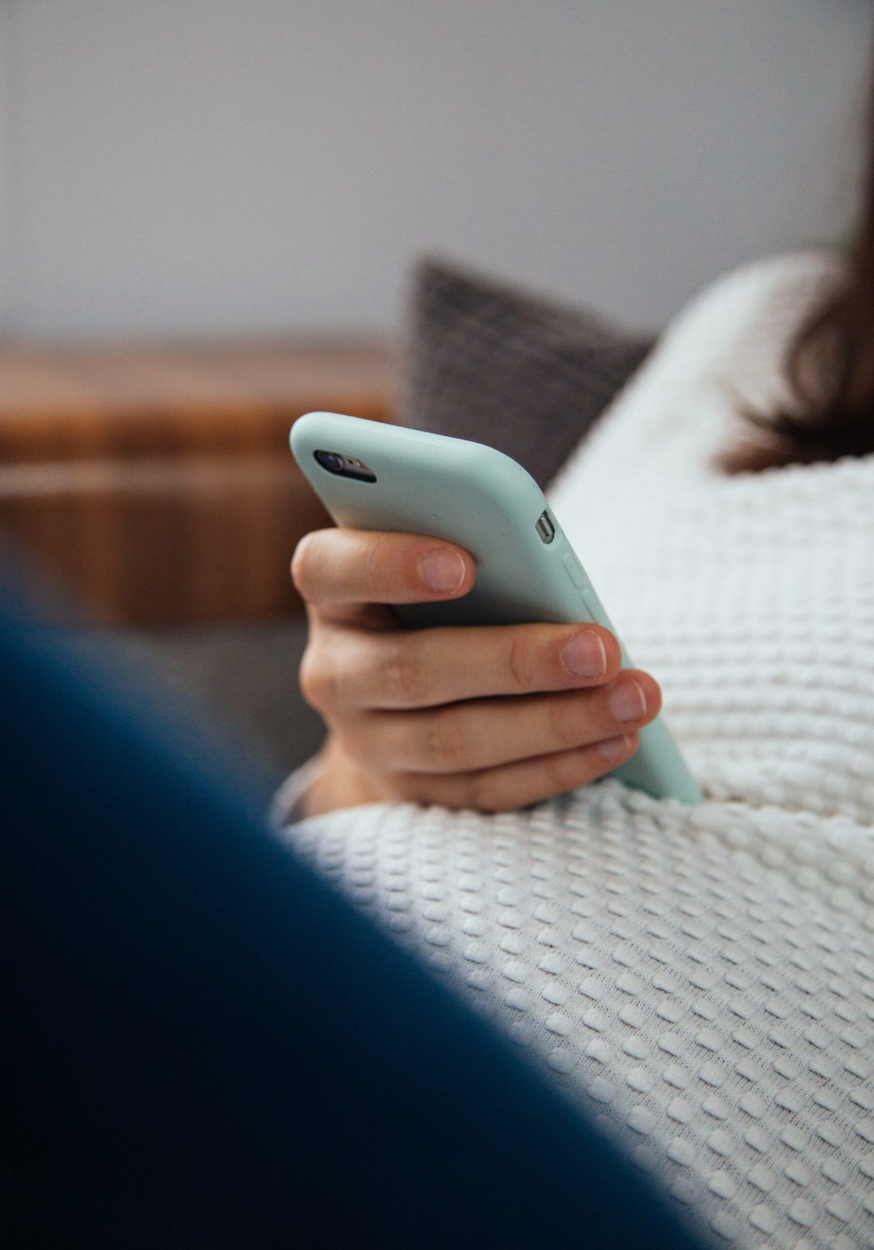 woman looking at phone - google algorithm update - digital nomad designs.jpg